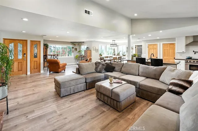 a open kitchen with stainless steel appliances granite countertop a sink and a stove