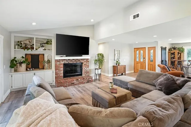 a kitchen with stainless steel appliances a stove a refrigerator and cabinets