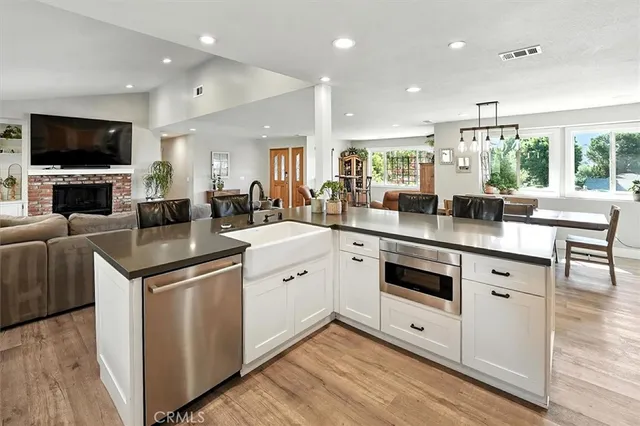 a bedroom with a large bed and a flat screen tv