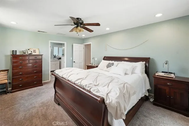 a view of a backyard with a garden and entertaining space