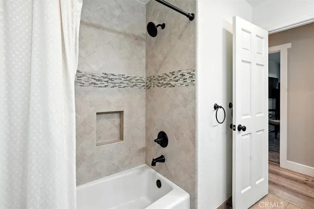 a room with gym equipment and a flat screen tv