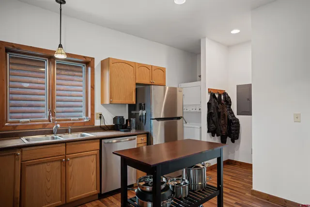 a kitchen with refrigerator and window