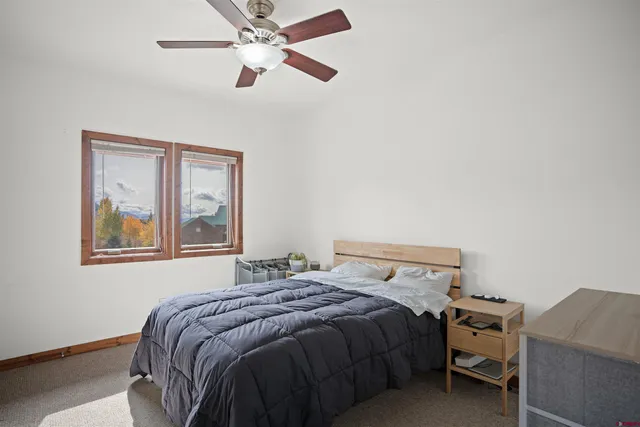 a bedroom with a bed and lamp