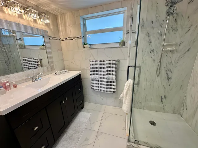 a bathroom with a shower and toilet