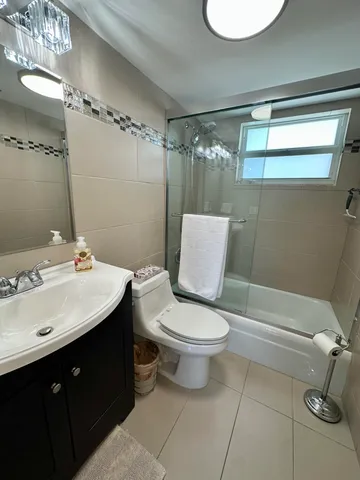 a view of balcony with two chairs and a table