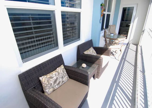 a view of balcony with furniture