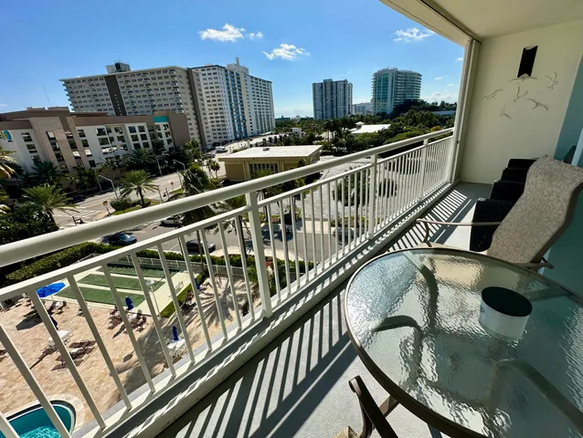 a view of a chairs and tables in patio