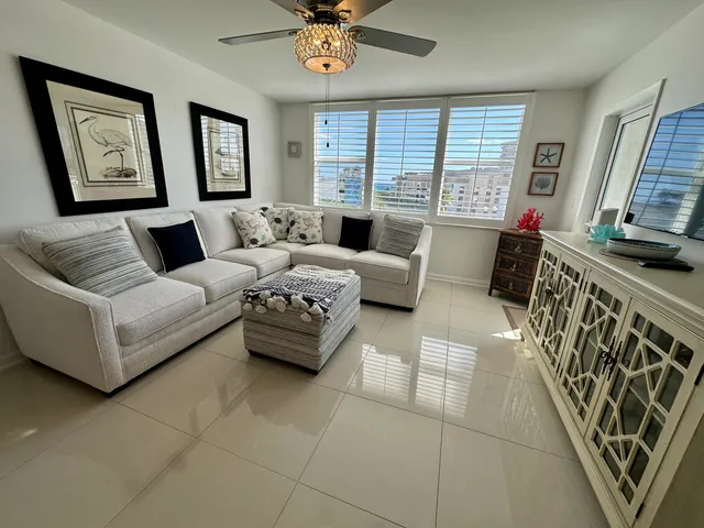 a bedroom with furniture and a flat screen tv