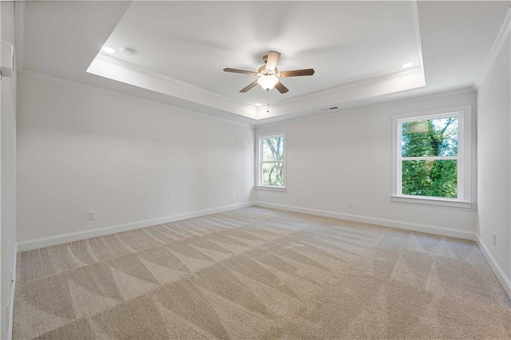 2126 Seavey Drive Decatur, GA 30032 - Photo 23 of 40 an empty room with windows and fan