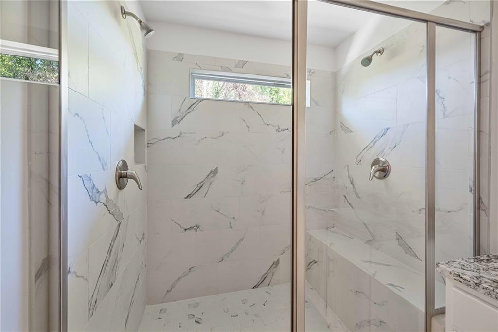 2126 Seavey Drive Decatur, GA 30032 - Photo 26 of 40 a bathroom with a glass shower door and a sink