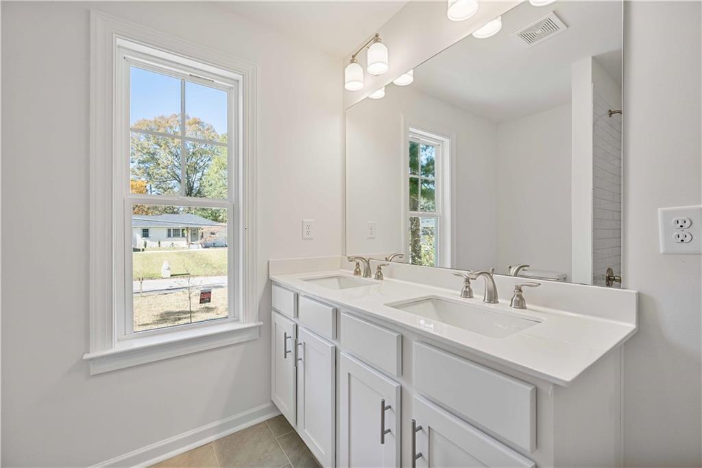 2126 Seavey Drive Decatur, GA 30032 - Photo 33 of 40 a bathroom with a sink and a mirror