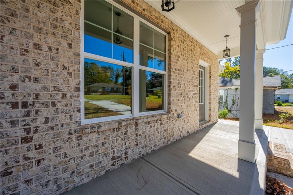 2126 Seavey Drive Decatur, GA 30032 - Photo 5 of 40 a view of a brick house with a large window