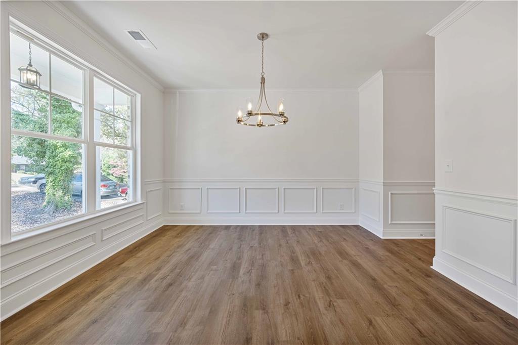 2126 Seavey Drive Decatur, GA 30032 - Photo 7 of 40 wooden floor in an empty room with a window