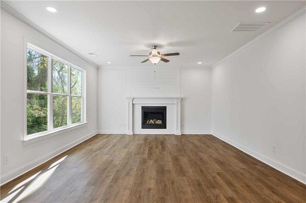 2126 Seavey Drive Decatur, GA 30032 - Photo 10 of 40 a view of an empty room with a window and a fireplace