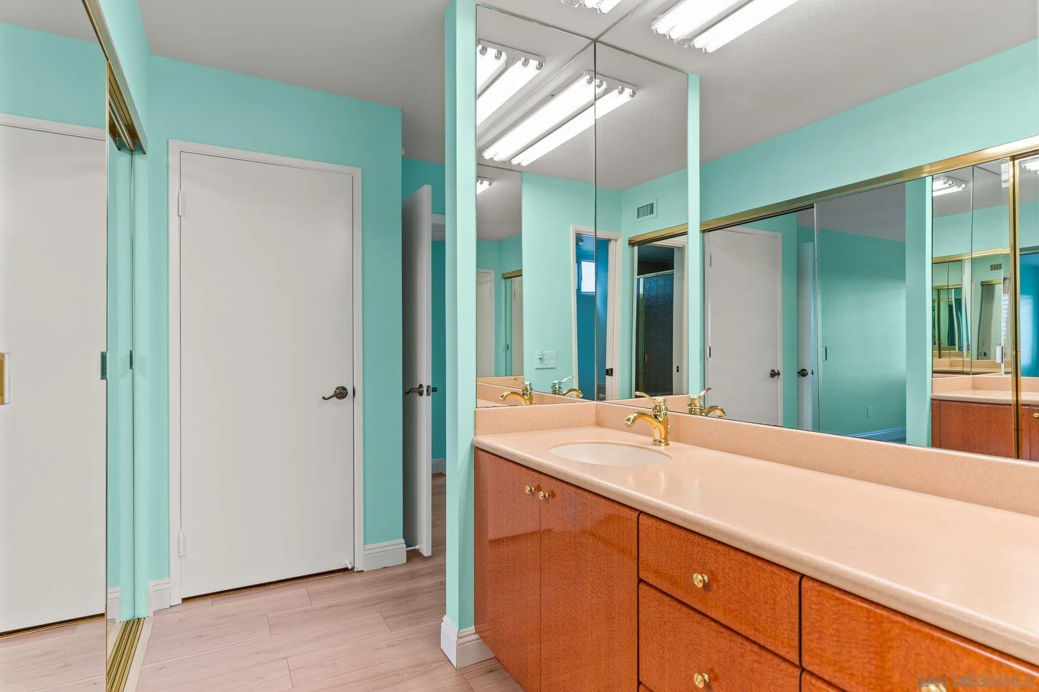 5668 Desert View Drive La Jolla, CA 92037 - Photo 14 of 23 a bathroom with a sink and a mirror