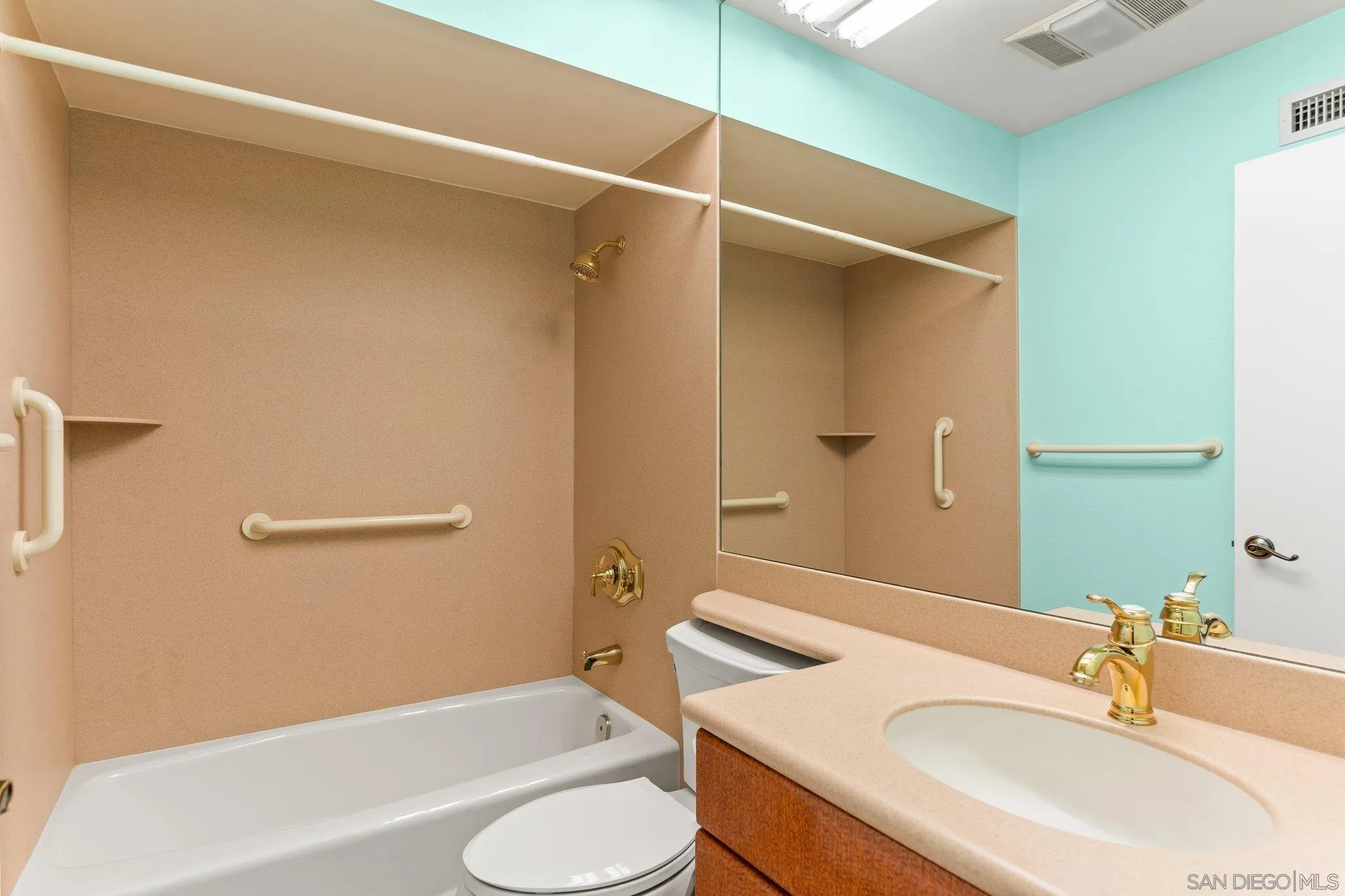 5668 Desert View Drive La Jolla, CA 92037 - Photo 17 of 23 a bathroom with a sink toilet and shower