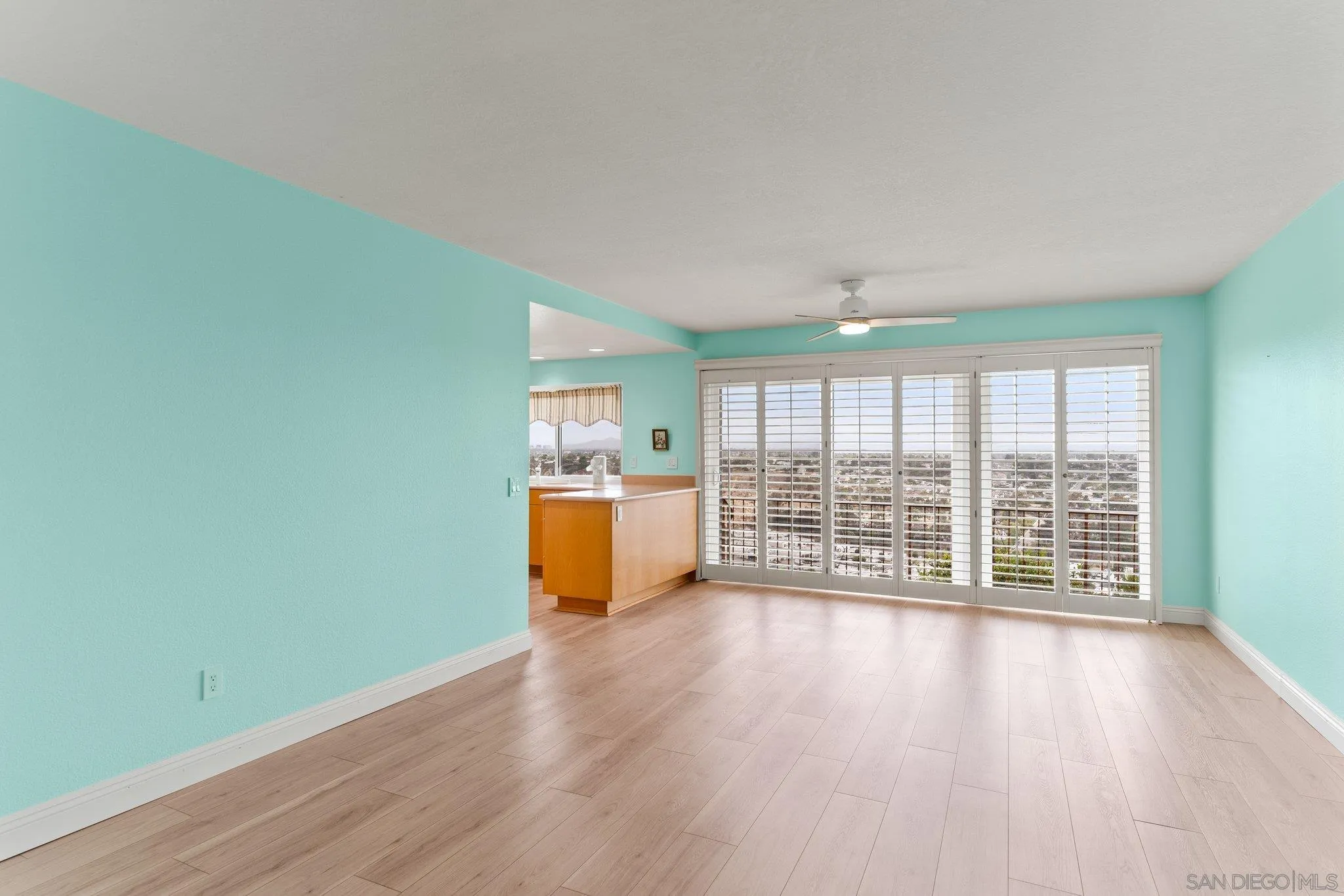 5668 Desert View Drive La Jolla, CA 92037 - Photo 9 of 23 a view of an empty room with wooden floor and a window