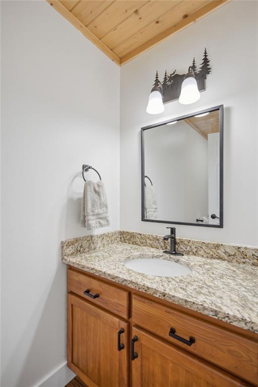 43 Morgan Walk Big Canoe, GA 30143 - Photo 11 of 66 a bathroom with a sink and vanity
