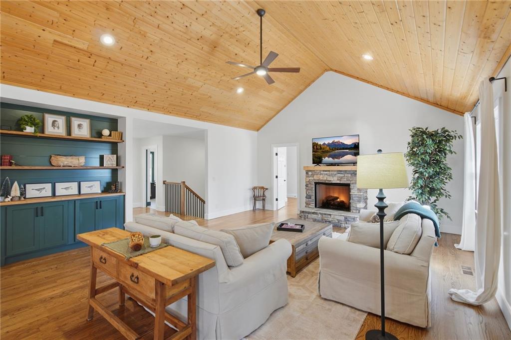 43 Morgan Walk Big Canoe, GA 30143 - Photo 15 of 66 a living room with furniture a fireplace and a potted plant