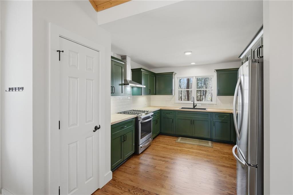 43 Morgan Walk Big Canoe, GA 30143 - Photo 16 of 66 a kitchen with a refrigerator and a sink