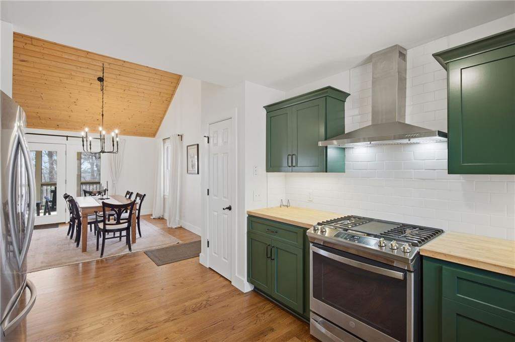 43 Morgan Walk Big Canoe, GA 30143 - Photo 18 of 66 a kitchen with stainless steel appliances granite countertop a stove a sink and a refrigerator