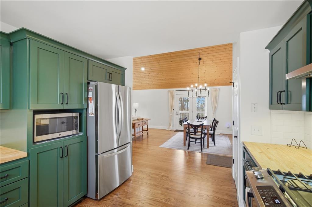 43 Morgan Walk Big Canoe, GA 30143 - Photo 19 of 66 a kitchen with stainless steel appliances granite countertop furniture and a refrigerator
