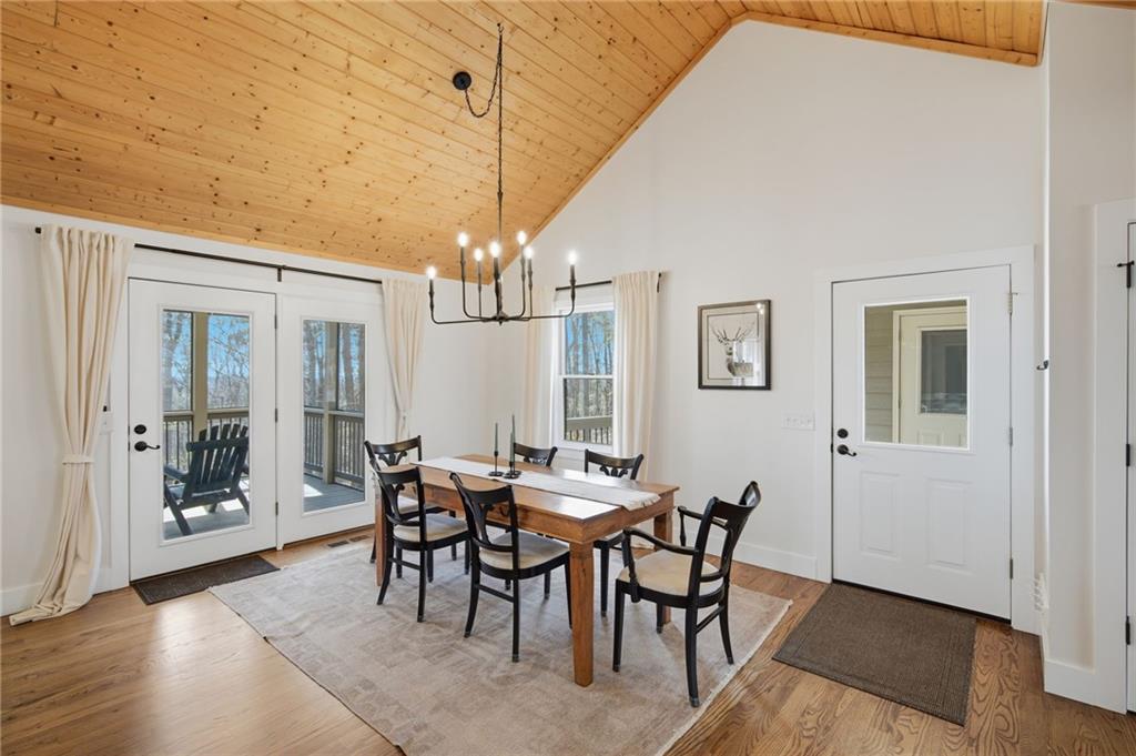43 Morgan Walk Big Canoe, GA 30143 - Photo 20 of 66 a view of a dining room with furniture and chandelier