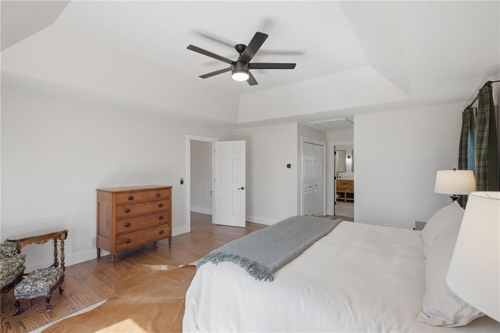 43 Morgan Walk Big Canoe, GA 30143 - Photo 23 of 66 a bedroom with a bed and a dresser