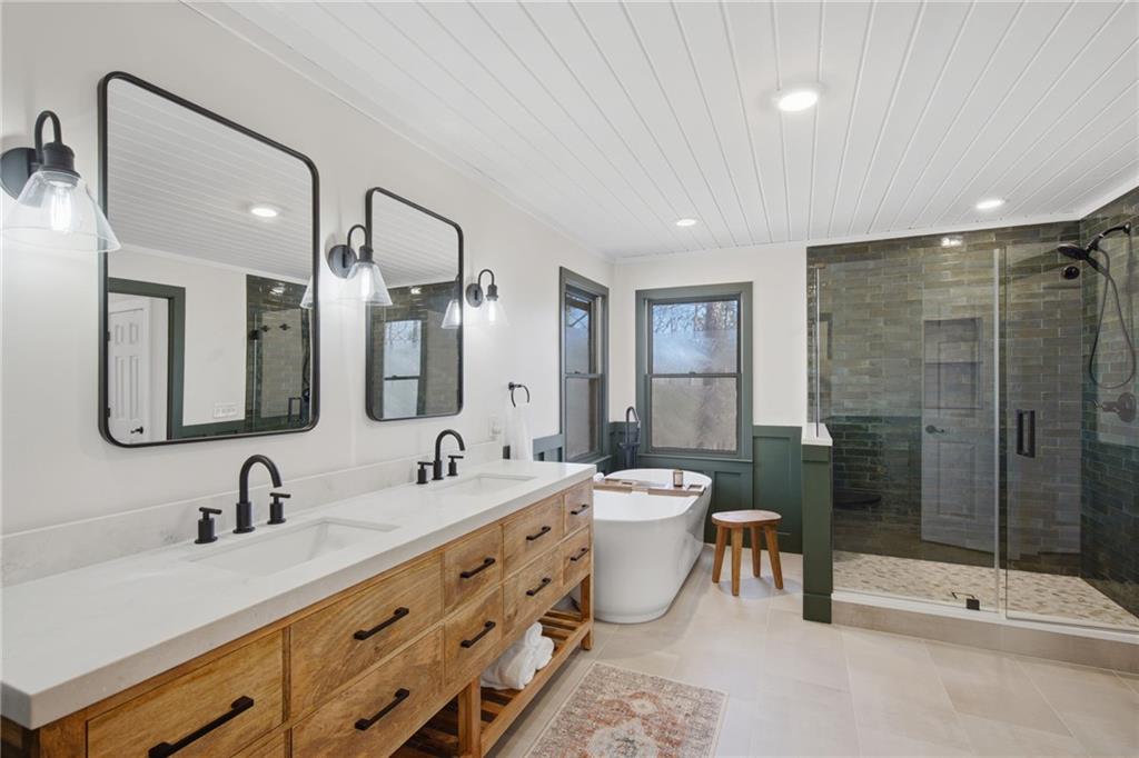 43 Morgan Walk Big Canoe, GA 30143 - Photo 25 of 66 a bathroom with a double vanity sink mirror and toilet