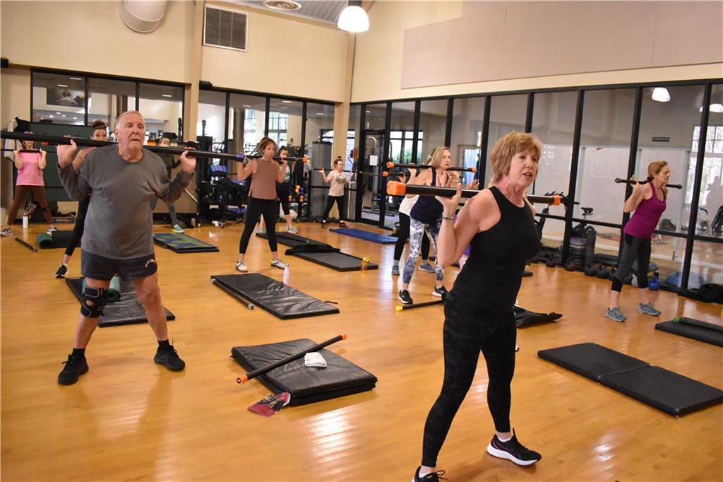 43 Morgan Walk Big Canoe, GA 30143 - Photo 62 of 66 a room with gym equipment and a view of living room