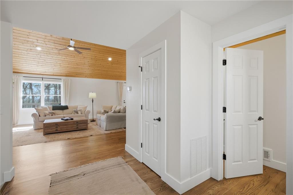 43 Morgan Walk Big Canoe, GA 30143 - Photo 10 of 66 a living room with furniture and a large window