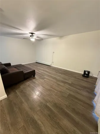 a view of a livingroom with wooden floor