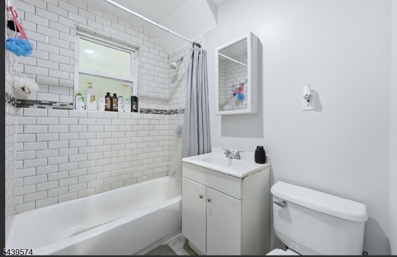 328 John Street Elizabeth, NJ 07202 - Photo 6 of 9 a bathroom with a sink toilet and shower