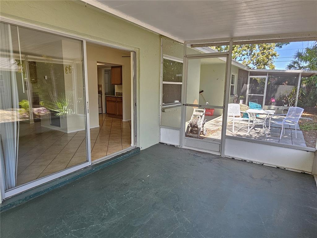 105 Base Avenue East Venice, FL 34285 - Photo 13 of 31 a living room with furniture and a large window
