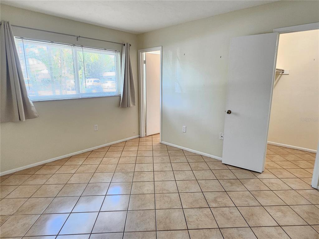 105 Base Avenue East Venice, FL 34285 - Photo 18 of 31 a view of an empty room and window