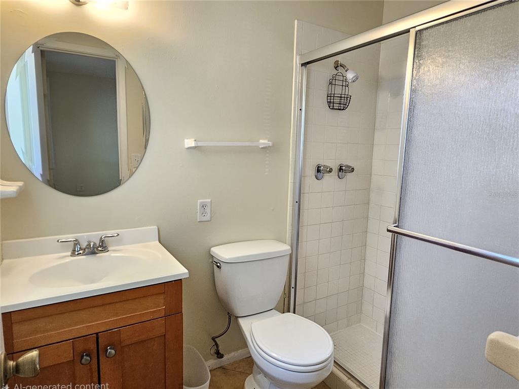 105 Base Avenue East Venice, FL 34285 - Photo 21 of 31 a bathroom with a toilet a sink and a mirror