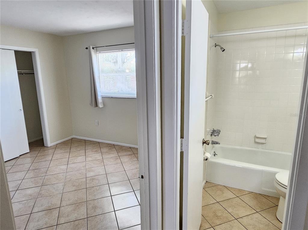 105 Base Avenue East Venice, FL 34285 - Photo 22 of 31 a bathroom with a bathtub