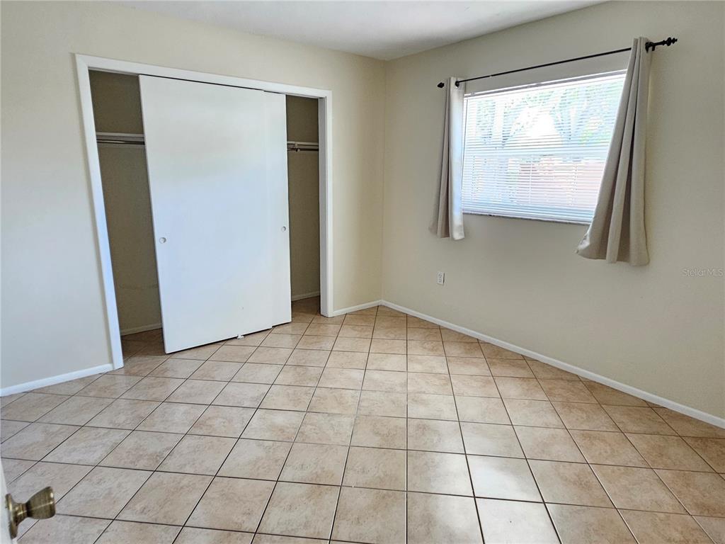 105 Base Avenue East Venice, FL 34285 - Photo 23 of 31 an empty room with windows