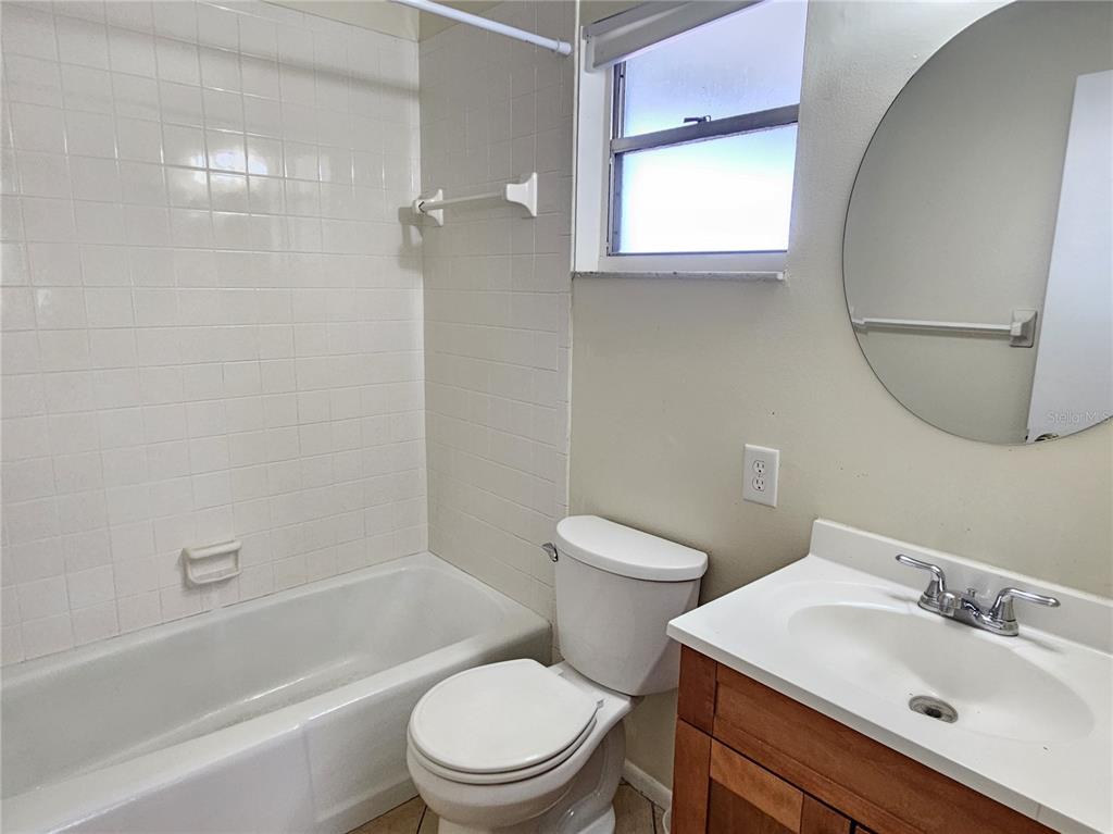 105 Base Avenue East Venice, FL 34285 - Photo 26 of 31 a bathroom with a sink toilet and shower