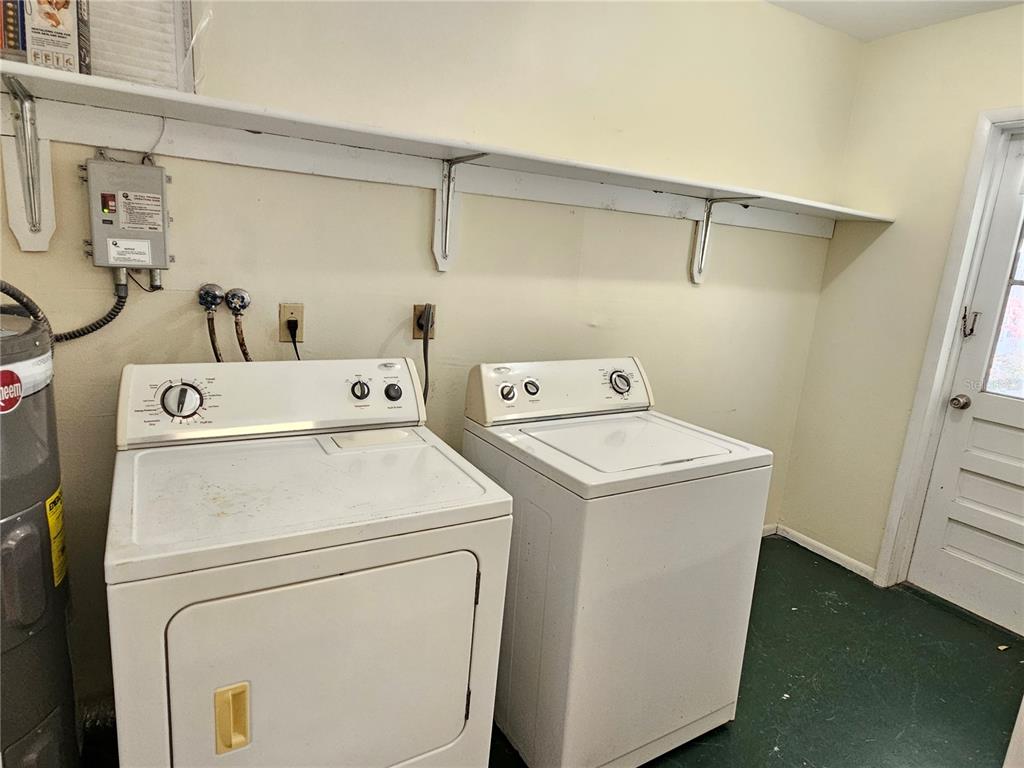 105 Base Avenue East Venice, FL 34285 - Photo 27 of 31 a utility room with dryer and washer