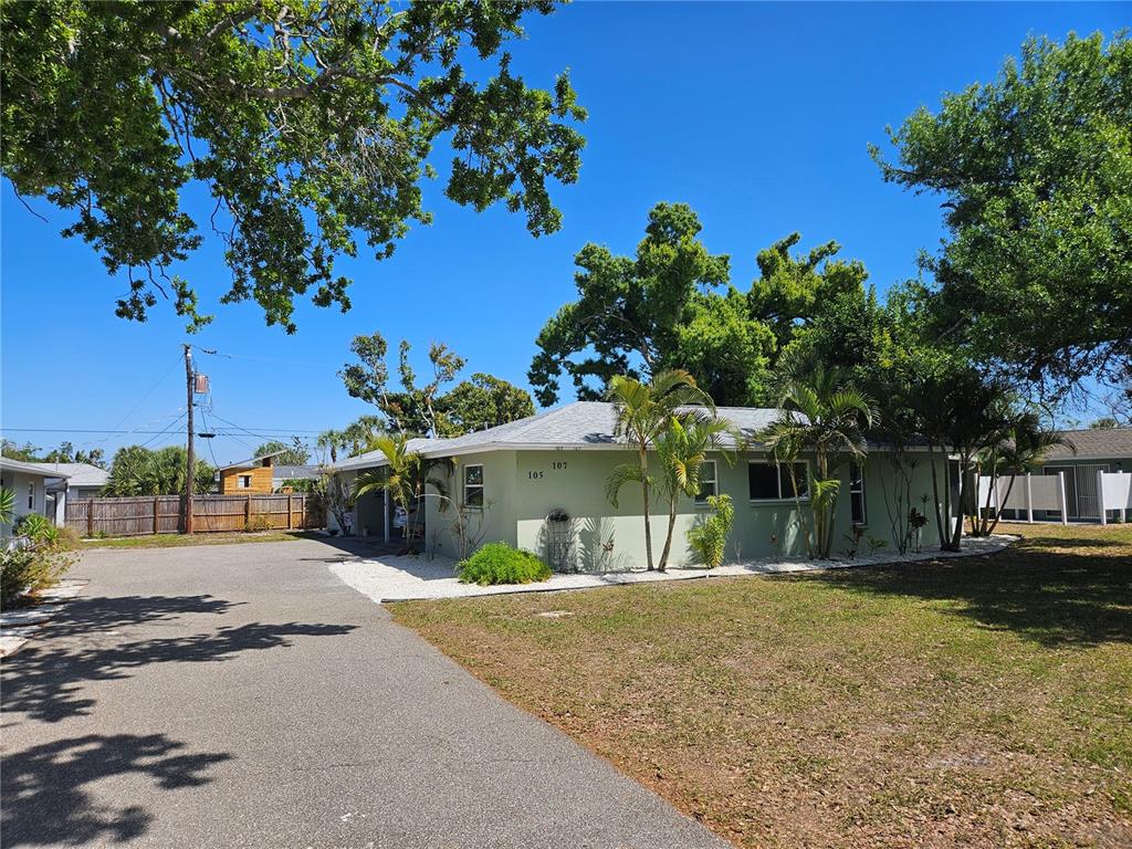 105 Base Avenue East Venice, FL 34285 - Photo 31 of 31 a front view of a house with a yard