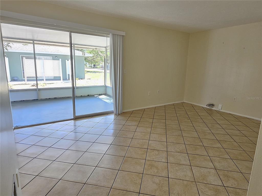 105 Base Avenue East Venice, FL 34285 - Photo 4 of 31 a view of an empty room and window