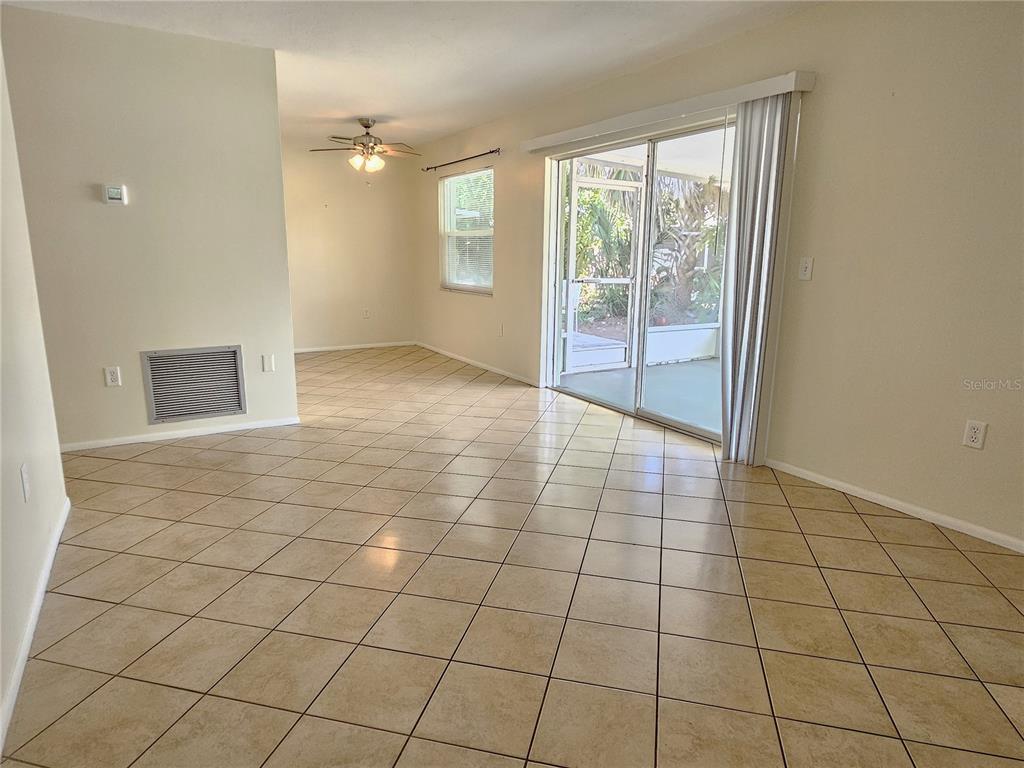 105 Base Avenue East Venice, FL 34285 - Photo 5 of 31 a view of an empty room and window