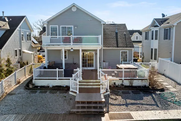 a view of outdoor space with a deck and furniture