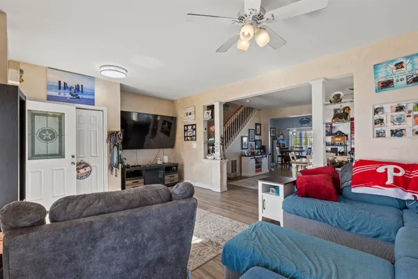 a living room with furniture and a flat screen tv