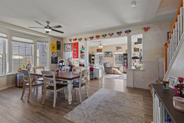 a view of a dining room with furniture window and wooden floor