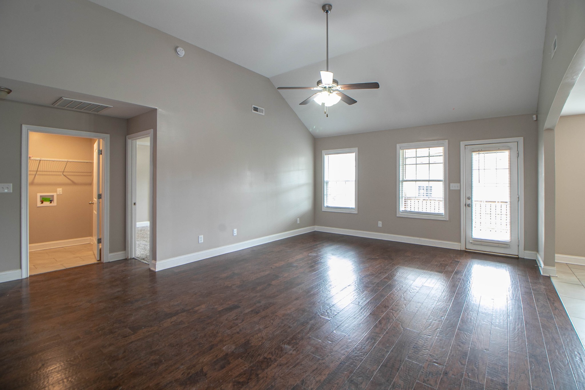 151 Ambridge Street Oak Grove, KY 42262 - Photo 5 of 30 an empty room with wooden floor and windows