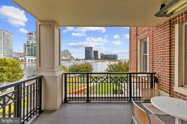a view of a balcony with furniture