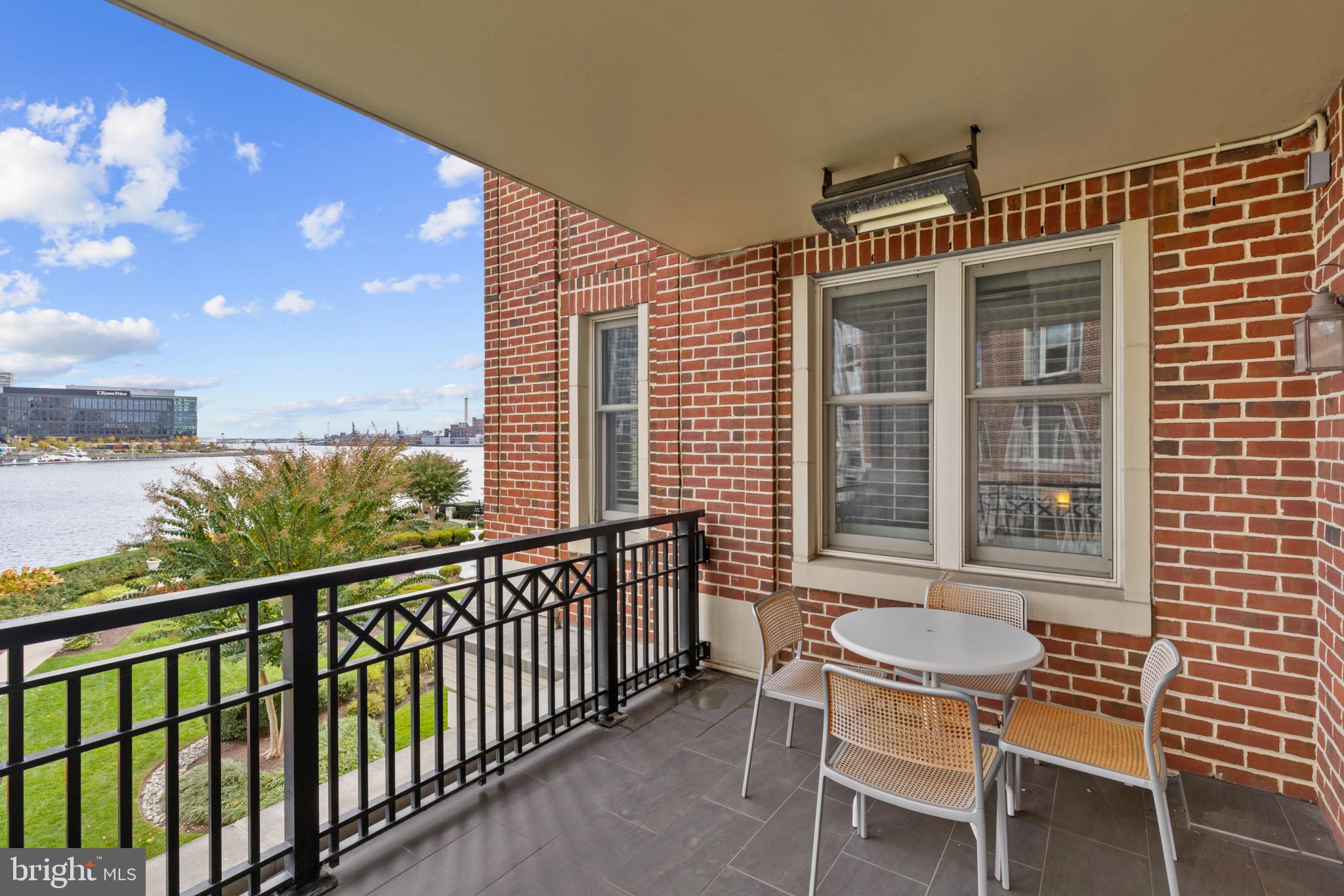801 Key Highway, Unit 339 Baltimore, MD 21230 - Photo 16 of 44 a view of a chair and table in the balcony