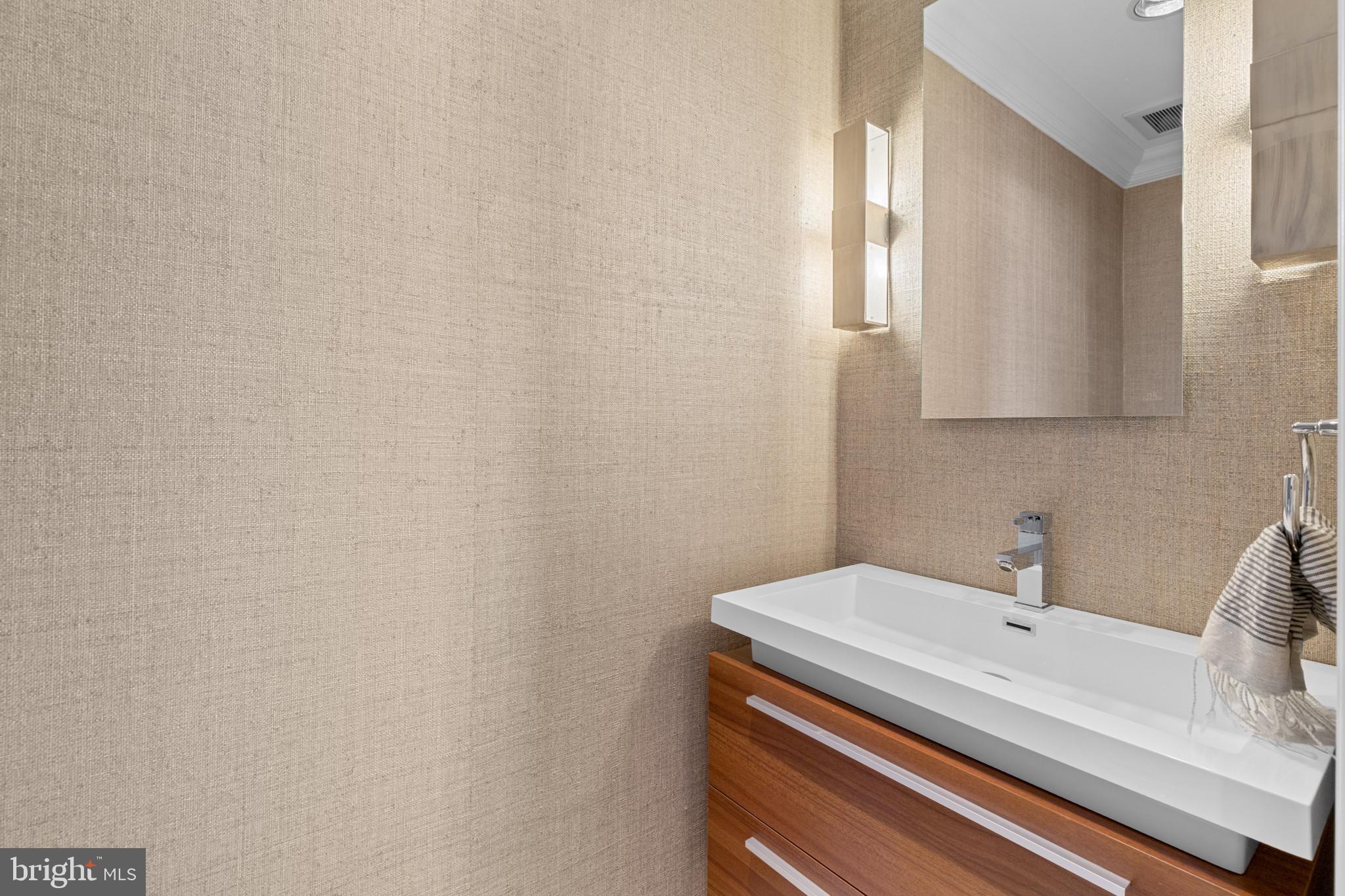 801 Key Highway, Unit 339 Baltimore, MD 21230 - Photo 19 of 44 a bathroom with a sink and a mirror